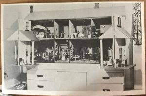 black and white photo of a dollhouse